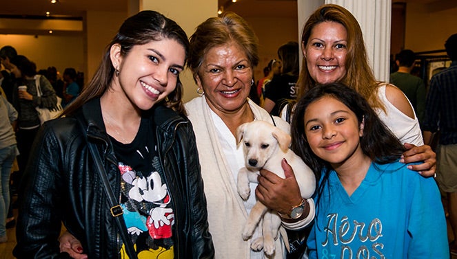 Family with their adopted puppy