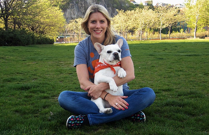 New York volunteer Kirstin Burdett with a Scooter the French bulldog