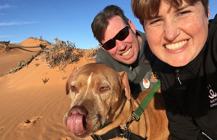 Kat and Dwayne enjoy a walk with Doc