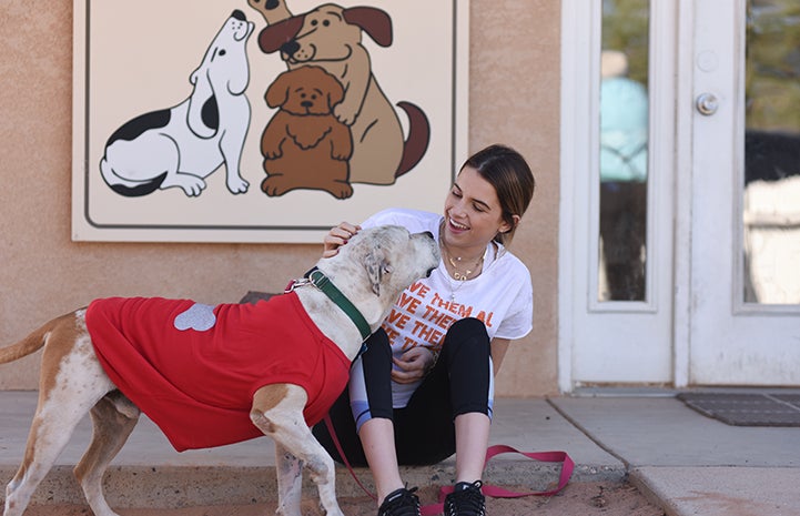 Katie McEvoy with a new dog friend at Dogtown