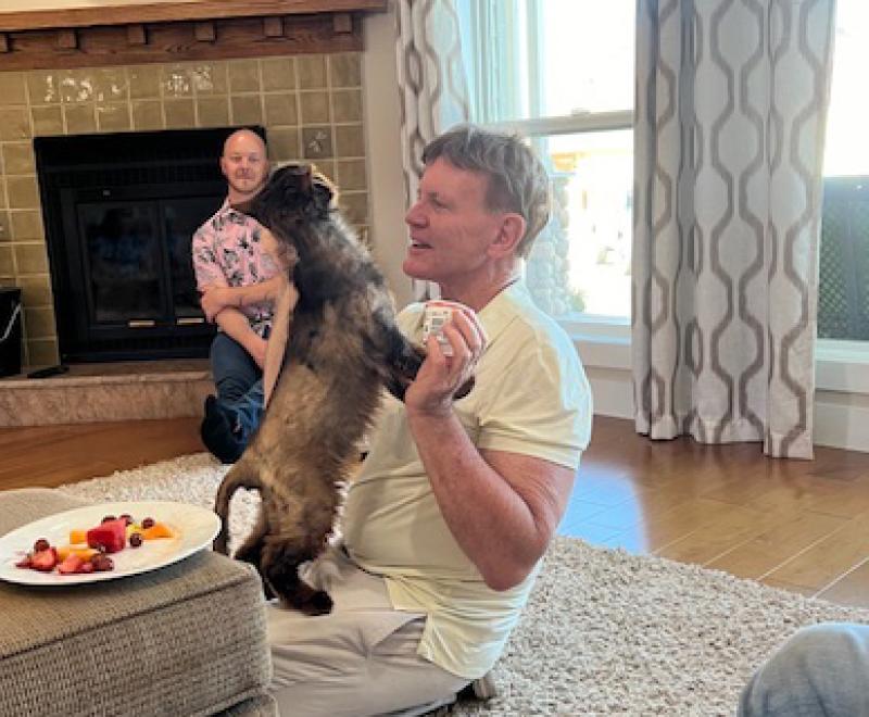 Volunteer Bill Coaker with Pepe the cat at home