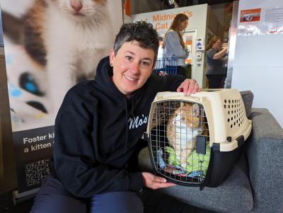 Janet holding Ruby the cat in a carrier