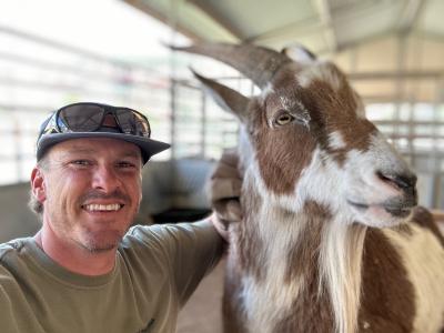 Andrew and Rusty the goat at the Sanctuary