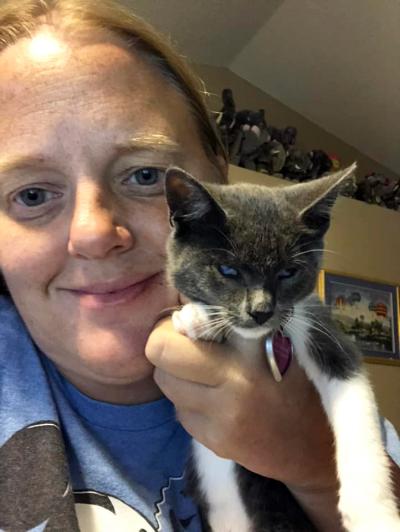 Jasmine Marie holding Ellie Rose the blind gray and white kitten