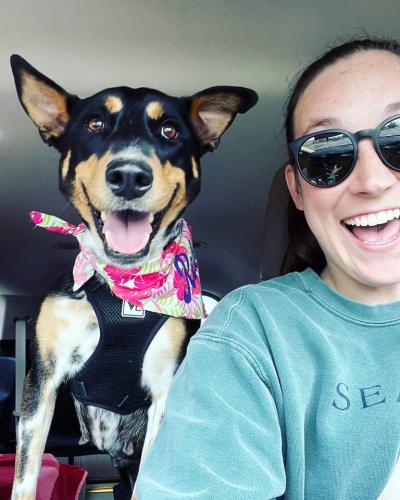 Bailey with Rebel the dog, both widely smiling