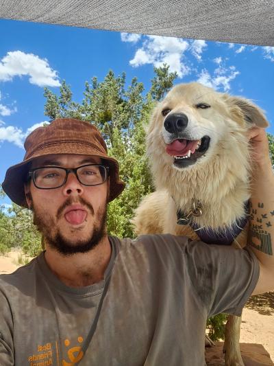 Ben Oriordan-Tingley next to a dog with both their tongues out