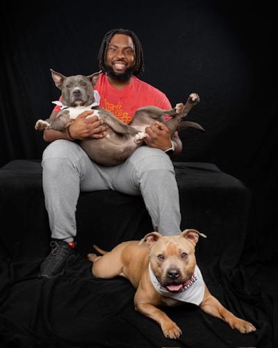 Kansas City Chiefs player Derrick Nnadi with his two dogs Rocky and Saint