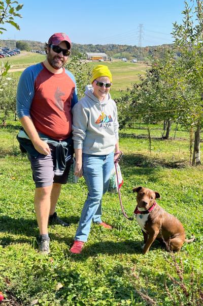 Dandelion the dog with Matthew and Heather her adopters