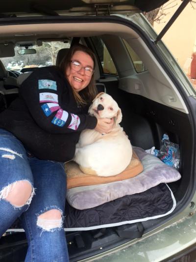 Leslie and Honey the dog ready to go home