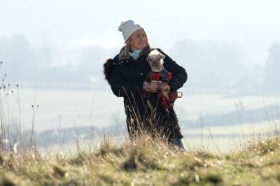 Holly Middleton outside holding Peggy the dog