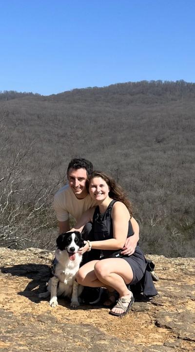 Alex and Madelyn outside with Ducky the dog