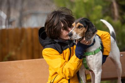 Gavin Spencer outside hugging Blair the dog