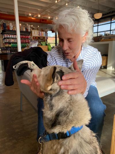 Volunteer from MenHealing petting a dog