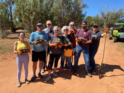 Group of volunteers from MenHealing holding toroises