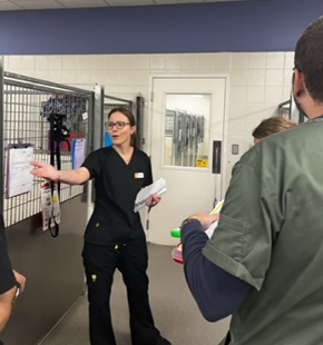 Person gesturing with her hand during population rounds