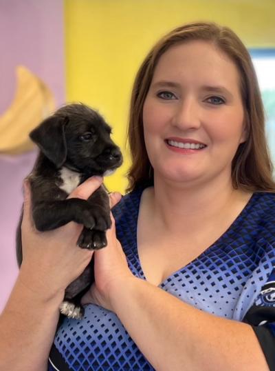 Skylar Clark's mom holding a puppy