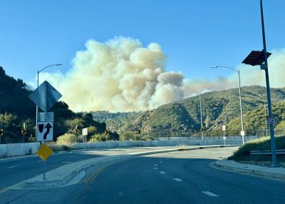 Smoke from the Los Angeles wildfires in the distance over a hill