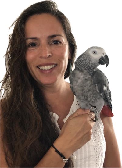 Michelle Bertonneau holding Z, her African grey parrot