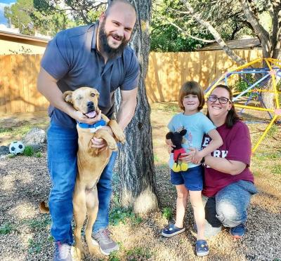 Scooby the dog with his new family