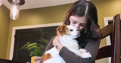 Hannah Riley with Hazel the dog after being reunited