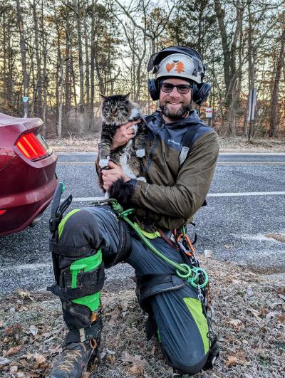 Steven Murrow holding a cat he'd rescued from a tree