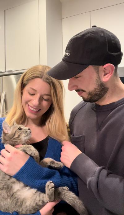 Cara and Matt holding Daisy the cat