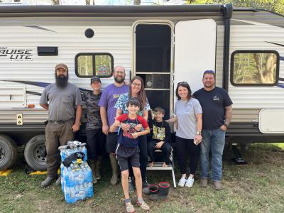 Blanco the cat's family in front of the RV donation