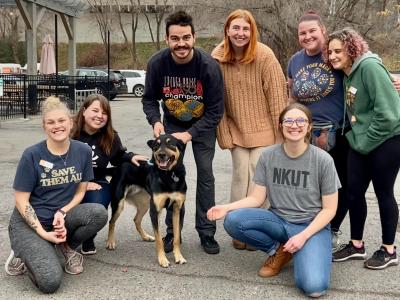 Heath the dog with a group of seven people