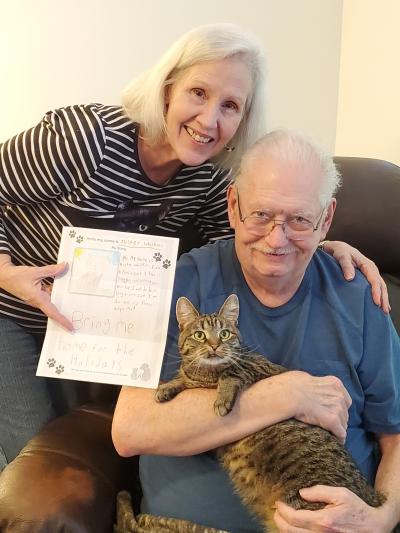 Mister Whiskers the cat with his new family along with the bio written by the sixth grader