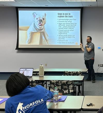 Person showing a "Steps to use to explore the fears" slide at the Virginia Is for Animal Lovers Shelter Summit