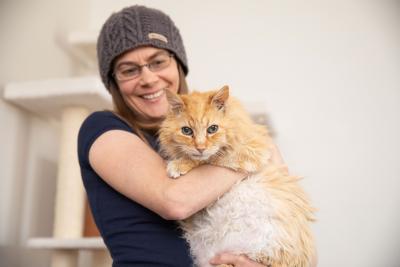 Alida holding Cinna the cat