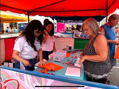 Ira and Vanni working at the shelter's informational booth