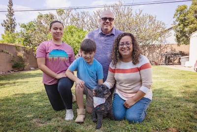 Zoey the dog with her adoptive family