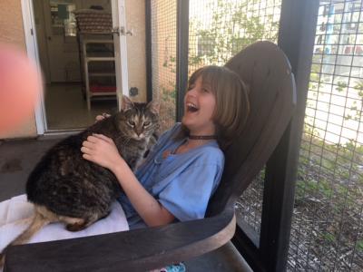 Delaney with Zelda the cat in her lap