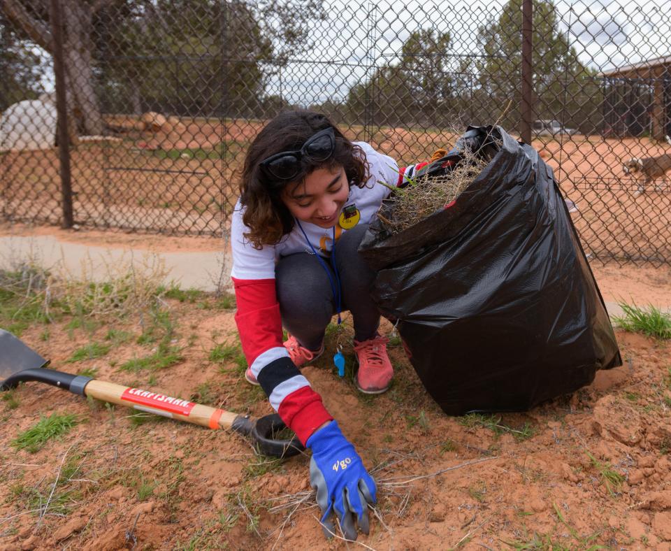 Smiling person clean up weeds